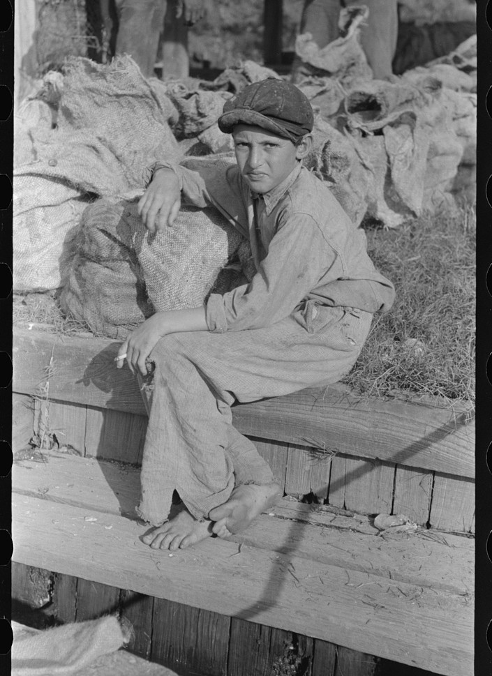 Son of a strawberry picker resting near Lakeland, Florida, 1939