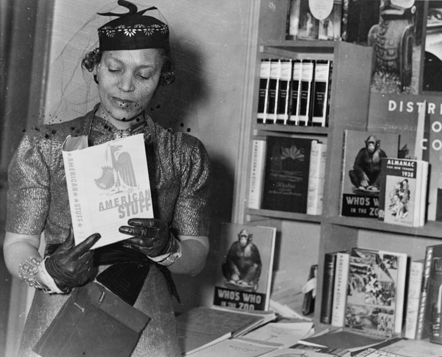 Zora Neale Hurston at the New York Times Book Fair holding American Stuff, 1937